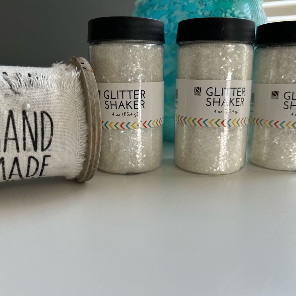 Glitter shakers (3) & decorative cloth ribbon roll great for arts & crafts.